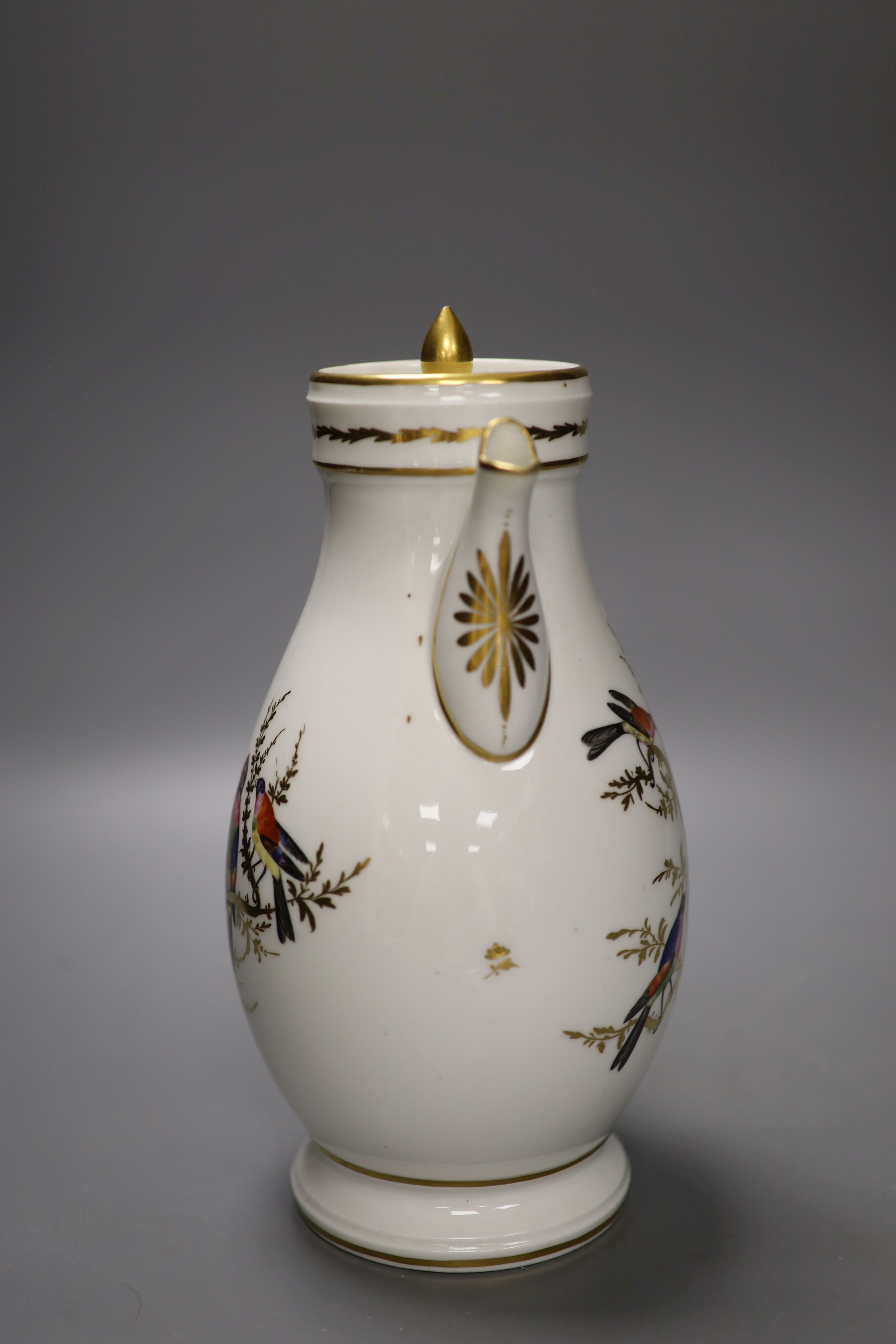 A French chocolate pot and cover finely painted with birds in gilded trees, incised mark, perhaps M, late 18th century, height 26cm